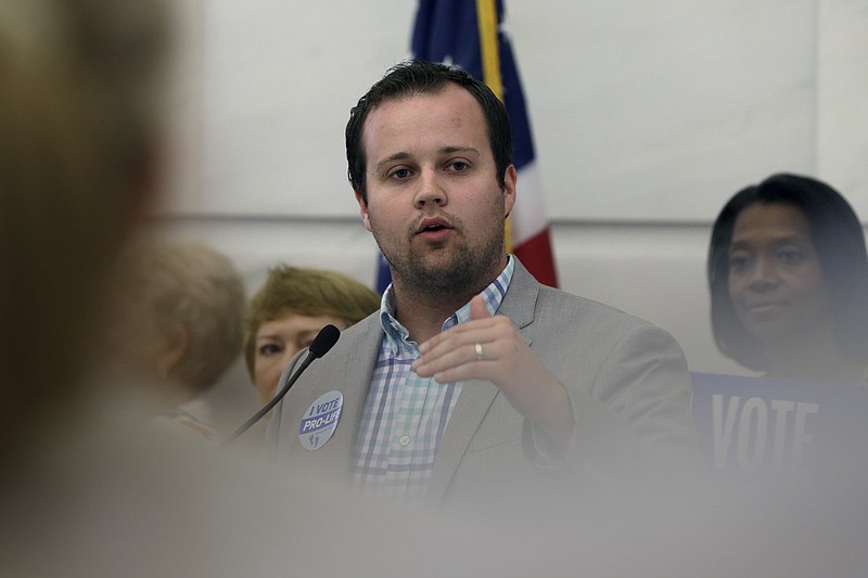 In this Aug. 29, 2014 file photo, Josh Duggar, executive director of FRC Action, speaks in favor the Pain-Capable Unborn Child Protection Act at the Arkansas state Capitol in Little Rock, Ark. A federal appeals court has ruled that a lawsuit filed by four reality show sisters can proceed against an Arkansas city that released confidential information about their alleged sexual abuse by a brother. The Eighth Circuit Court of Appeals ruled Friday, July 12, 2019 that Jill Duggar Dillard, Jessa Duggar Seewald, Jinger Duggar Vuolo and Joy Duggar expected privacy when officials from the city of Springdale and Washington County, Arkansas investigated claims that their brother Josh sexually abused them. (AP Photo/Danny Johnston, File)