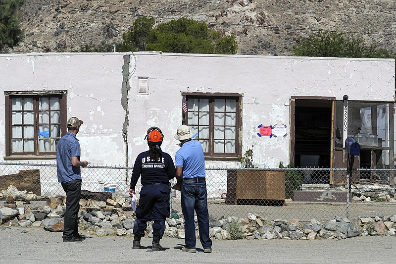 San Bernardino county officials going home-to-home to check structural integrity on Friday, July 12, 2019, in Trona, Calif., after two earthquakes the previous week. (Irfan Khan/Los Angeles Times/TNS)