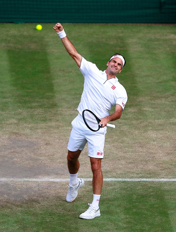 Roger Federer celebrates after beating Rafael Nadal in Friday's men's singles semifinal match at the Wimbledon Championships in London.