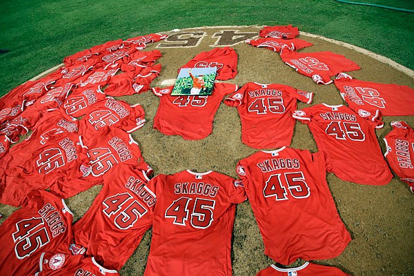 Jerseys with pitcher Tyler Skaggs' number are placed on the mound after the Angels completed a combined no-hitter against the Mariners during Friday night's game in Anaheim, Calif.