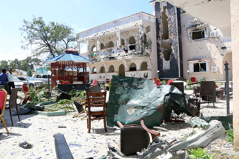 A view of Asasey Hotel after an attack, in Kismayo, Somalia, Saturday July 13, 2019.  At least 10 people, including two journalists, were killed in an extremist attack Friday on a hotel in the port city of Kismayo, a Somali official said. The attack started with a suicide car bomb blast and then gunmen stormed into the hotel. (AP Photo)