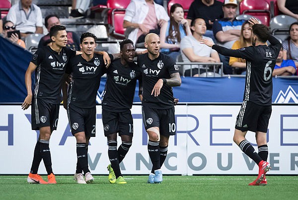 (From left) Sporting Kansas City's Daniel Salloi, Felipe Gutierrez, Gerso Fernandes, Yohan Croizet and Ilie Sanchez celebrate Gutierrez's goal against the Vancouver Whitecaps during the second half of Saturday's MLS match in Vancouver, British Columbia.