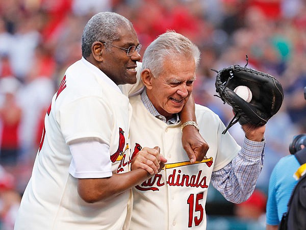 In this May 17, 2017, file photo, Bob Gibson (left) and Tim McCarver, members of the Cardinals' 1967 World Series championship team, take part in a ceremony honoring the 50th anniversary of the victory before a game between the Cardinals and the Red Sox in St. Louis. The St. Louis Post-Dispatch said Gibson was diagnosed with pancreatic cancer several weeks ago and revealed the news Saturday to the other living Hall of Famers.