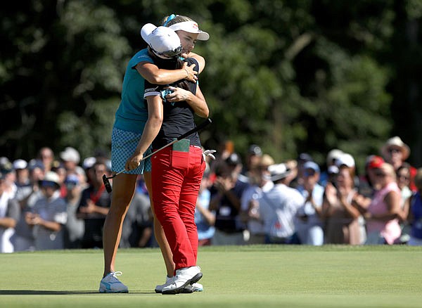 Winner Sei Young Kim is hugged by runner-up Lexi Thompson on hole No. 18 after Sunday's final round of the LPGA Marathon Classic at Highland Meadows Golf Club in Sylvania, Ohio.