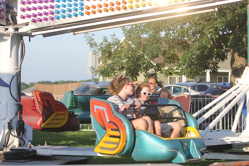 Residents enjoy rides at the Prairie Home Fair on July 13, 2019.