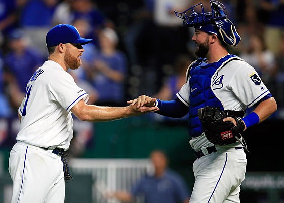 Royals closer Ian Kennedy shakes hands with catcher Cam Gallagher following Monday night's win against the White Sox at Kauffman Stadium.