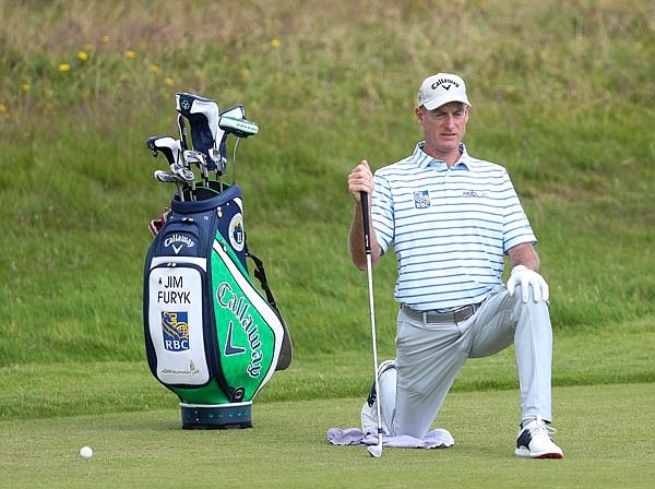 Jim Furyk stretches on the first fairway during a practice round Tuesday for the British Open at Royal Port Rush in Northern Ireland.