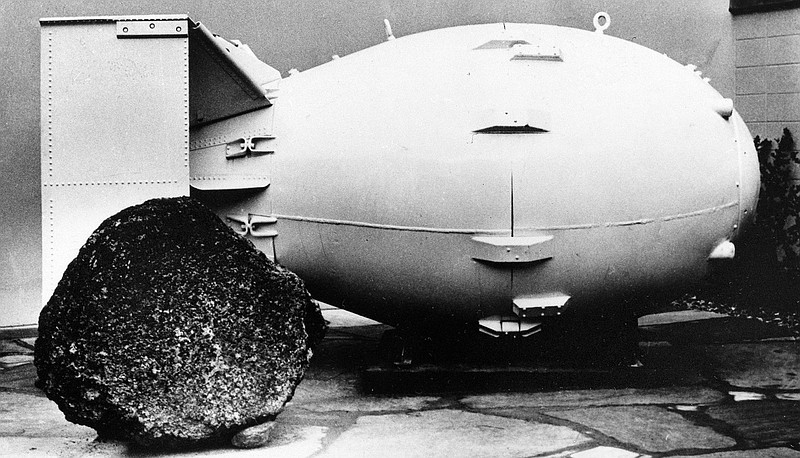 This Oct. 15, 1965, file photo shows a "Fat Man" nuclear bomb of the type tested at Trinity Site, N.M, and dropped on Nagasaki, Japan in 1945, on view for the public at the Los Alamos Scientific Laboratory Museum. A compensation program for those exposed to radiation from years of nuclear weapons testing and uranium mining would be expanded under legislation that seeks to address fallout across the western United States, Guam and the Northern Mariana Islands. (AP Photo, File)