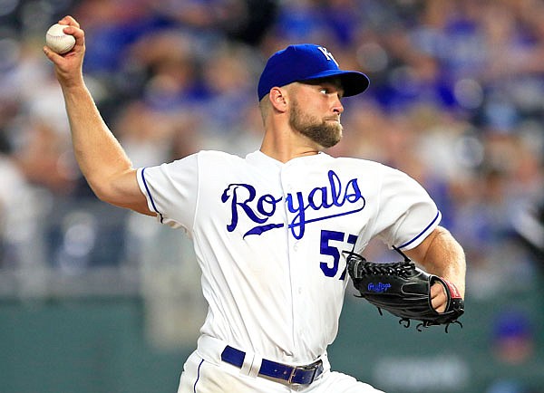 Royals starting pitcher Glenn Sparkman delivers to a White Sox batter during the ninth inning of Tuesday night's game at Kauffman Stadium. Sparkman threw a five-hitter as the Royals won 11-0.