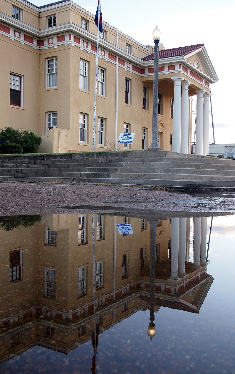 It's hard to double the size of the Cass County Courthouse, but with the recent rains and ponding of water, a reflection in the street does the trick.