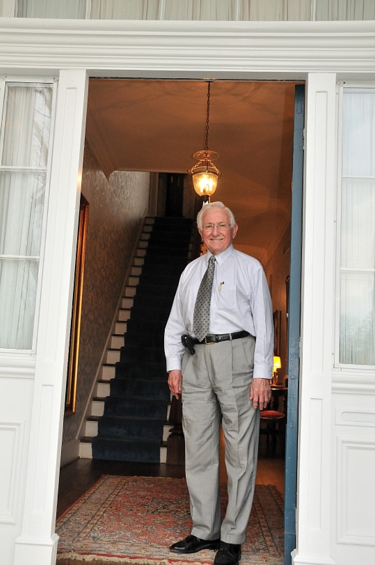 <p>Attorney Nicholas Monaco poses at the front entrance of his home at 1122 Moreau Drive.</p>