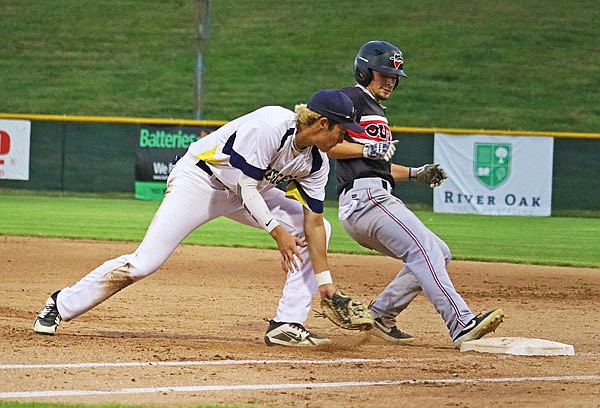 Renegades first baseman Lincoln Orellana attempts to tag Zack Ehlen of Joplin during Wednesday night's MINK League game at Vivion Field.