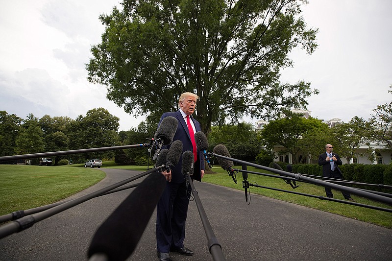 President Donald Trump speaks with reporters on the South Lawn of the White House before departing, Wednesday, July 17, 2019, in Washington. (AP Photo/Alex Brandon)