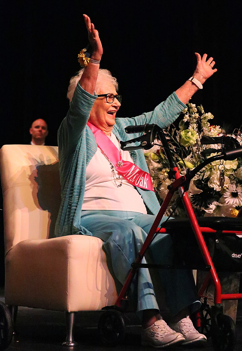 <p>Greta Cross/News Tribune</p><p>Alice Wehrle, of Oak Tree Villas, waves to the audience Thursday after being announced as the 2019 District 7 Ms. Missouri Nursing Home Pageant Queen. The pageant, hosted at the Etta & Joseph Miller Performing Arts Center, was sponsored by the Missouri Health Care Association. Ten women competed for the title.</p>