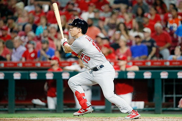 Tommy Edman of the Cardinals watches his grand slam in the sixth inning of Thursday night's game against the Reds in Cincinnati.