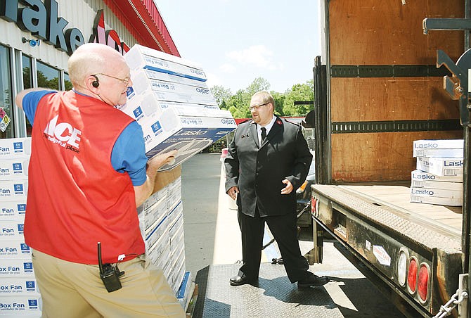 Just in time to try to beat the extreme heat, The Salvation Army picked up about 70 fans Thursday from Westlake Ace Hardware. Randy Miller, Westlake general manager, and Capt. Justin Windell load the items onto the truck where driver Tom Brant stacks them for transport to the Center of Hope for distribution.