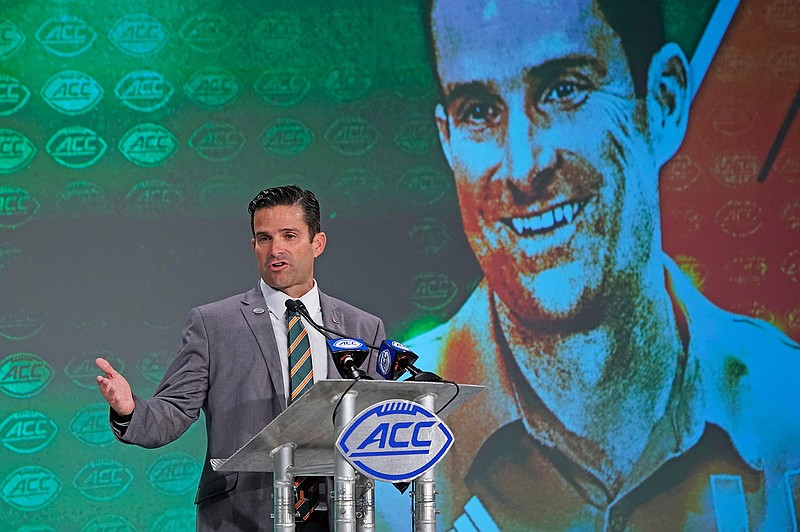 Miami head coach Manny Diaz speaks during the Atlantic Coast Conference NCAA college football media days in Charlotte, N.C., Thursday, July 18, 2019. (AP Photo/Chuck Burton)