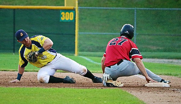 Renegades first baseman Paul Haupt attempts to beat David Butterfield of the Outlaws to the bag during Thursday night's game at Vivion Field.