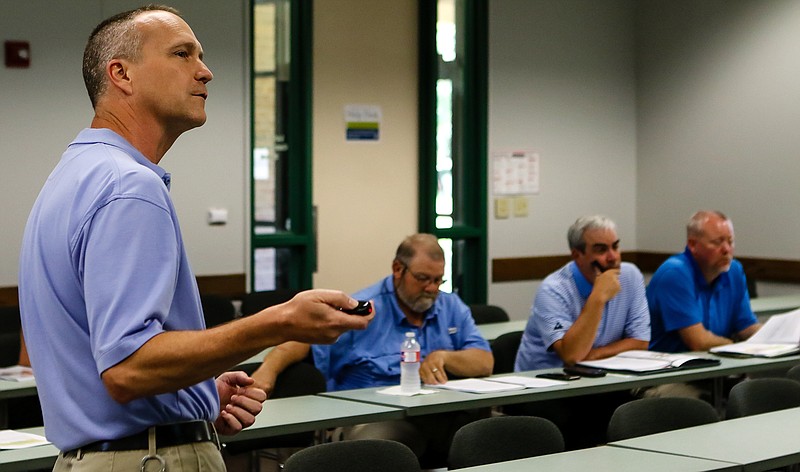 Dr. Ken Crane gives a presentation about the 2019 basin summary report to attendees Thursday at the annual Clear Rivers Steering Committee meeting at Texarkana College in Texarkana, Texas.