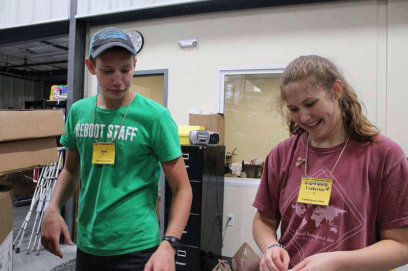 <p>Submitted</p><p>CHRISTpower participants help sort donations at the Samaritan Center.</p>