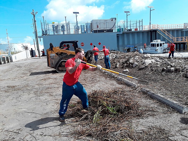 Terrebonne Parish inmate Gene LeBouef rakes debris Wednesday, July 17, 2019, that was left behind from Hurricane Barry at the Petit Caillou Floodgate in Cocodrie, La. The cleanup project is a collaborative endeavor between the Sheriff's Office and parish and is scheduled to continue all week.