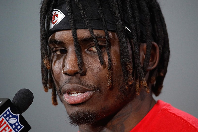 In this Jan. 18, 2019, file photo, Kansas City Chiefs wide receiver Tyreek Hill talks to the media after a workout in Kansas City, Mo. The NFL will not suspend Chiefs wide receiver Tyreek Hill under its personal conduct policy after the league investigating his involvement in a domestic violence incident involving his 3-year-old son. The league said in a statement Friday, July 19, 2019, that it has not been given access to information in the court proceedings, and a district attorney in June said an investigation was dropped because officials couldn't prove who injured the boy. (AP Photo/Charlie Riedel, File)