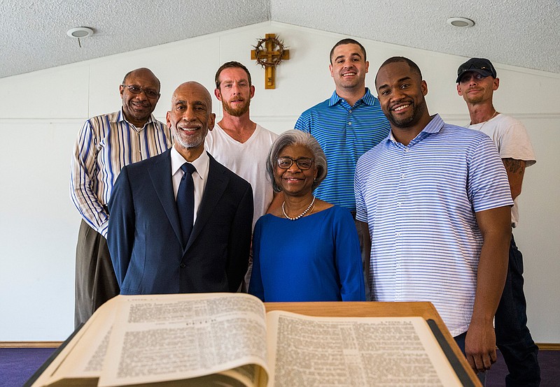 Don and Wanda Wesson, front left and center, and their son, Donald Wesson, right, pose for a photo July 3, 2019, with their partners, from left, Pastor Chris Simmons of Cornerstone Baptist Church, Adam Etlicher, Blake Cobb and James Grover inside the historic White Rock Chapel in Addison, Texas. The Wessons bought the church, which originally belonged to African American slaves, and the one-acre plot it sits on, and have been restoring the building. The original building was burned, and they estimated the current building was built in the 1960s.