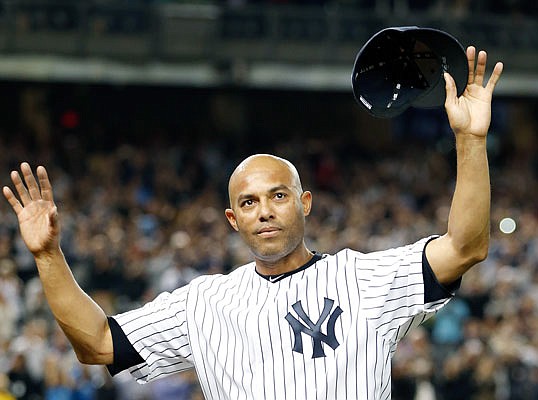 In this Sept. 26, 2013, file photo, Yankees relief pitcher Mariano Rivera acknowledges the crowd's standing ovation after coming off the mound in the ninth inning of his final appearance at Yankee Stadium.