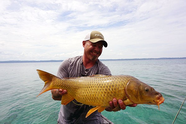 Austin Adduci holds a nice Lake Michigan carp.