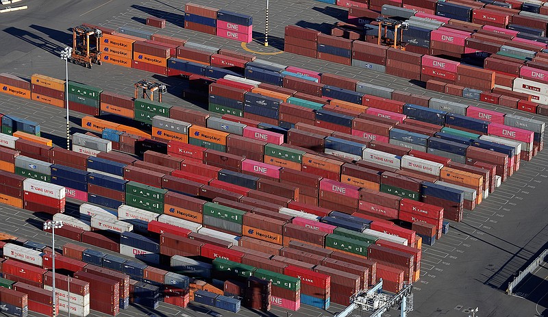 In this March 5, 2019, file photo, cargo containers are staged near cranes at the Port of Tacoma, in Tacoma, Wash. Some are moving factories out of China. Others are strategically redesigning products. Some are seeking loopholes in trade law or even mislabeling where their goods originate, all with the goal of evading President Donald Trump's sweeping tariffs on goods from China. (AP Photo/Ted S. Warren, File)