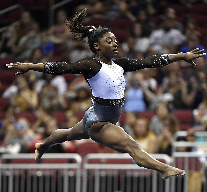 Simone Biles performs her floor routine during the GK US Classic gymnastics meet in Louisville, Ky., Saturday, July 20, 2019. (AP Photo/Timothy D. Easley)