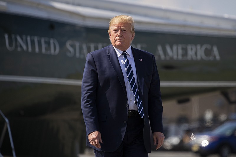 FILE -  In this Sunday, July 21, 2019 file photo, President Donald Trump walks on the tarmac to board Air Force One at Morristown Municipal Airport, in Morristown, N.J. Iran said Monday that it has arrested 17 Iranian nationals allegedly recruited by the Central Intelligence Agency to spy on the country's nuclear and military sites, and some of them have already been sentenced to death. Trump tweeted that the claim had "zero truth," calling Iran a "total mess."(AP Photo/Manuel Balce Ceneta, File)