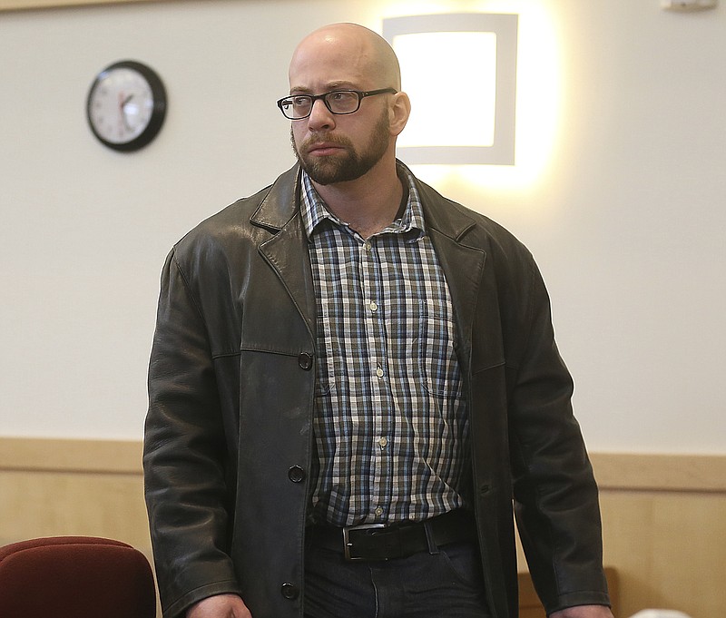 In this Feb. 7, 2019 file photo Max Misch walks out of the Bennington County courtroom in Bennington, Vt. Misch, a self-described white nationalist and "online troll" accused of harassing a black legislator has pleaded not guilty to violating a condition of release on gun-related charges. Misch was arraigned Monday, July 22, 2019. (Holly Pelczynski/The Banner via AP, file)