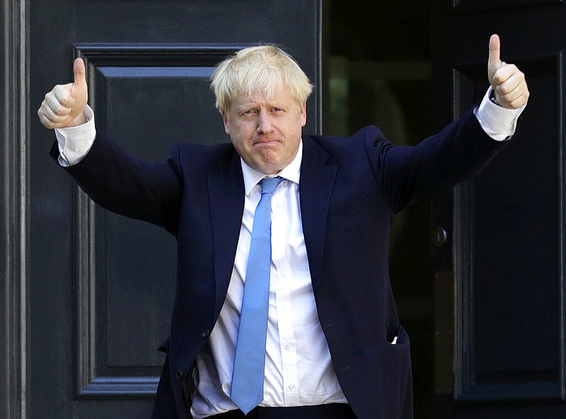 Newly elected leader of the Conservative party Boris Johnson arrives at Conservative party HQ in London, Tuesday, July 23, 2019. Brexit-hard-liner Boris Johnson, one of Britain's most famous and divisive politicians, won the race to lead the governing Conservative Party on Tuesday, and will become the country's next prime minister in a little over 24 hours. 