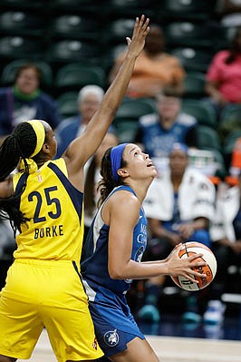 Napheesa Collier of the Lynx shoots against the defense of Kennedy Burke of the Fever during a WNBA game last month in Indianapolis.