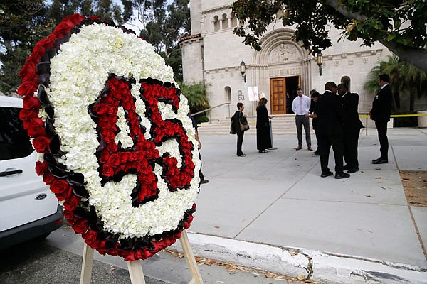 A floral arrangement with the jersey number for Angels pitcher Tyler Skaggs is outside St. Monica Catholic Church during a memorial service Monday in Los Angeles.