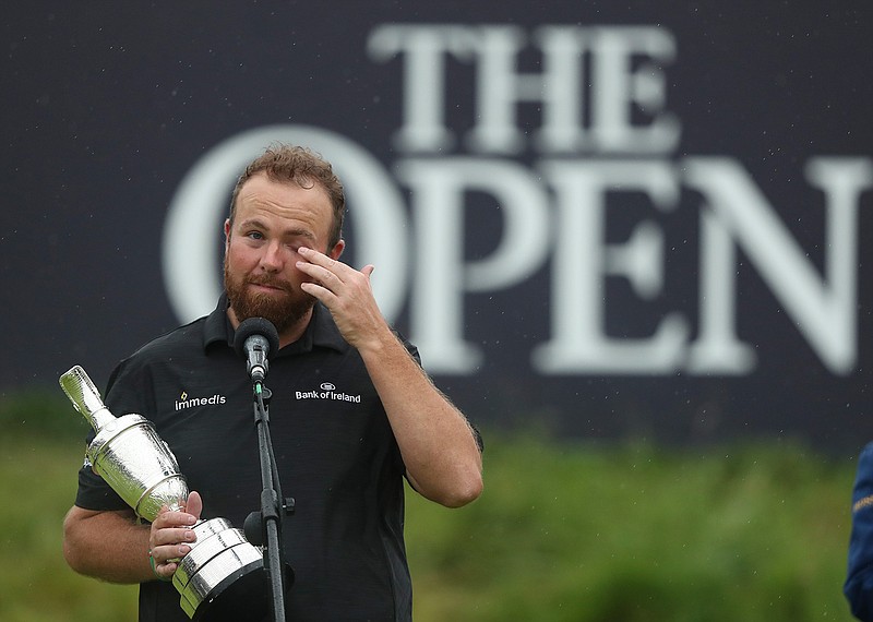 Ireland's Shane Lowry wipes away a tear as he makes a speech holding the Claret Jug trophy after winning the British Open Golf Championships at Royal Portrush in Northern Ireland, Sunday, July 21, 2019.(AP Photo/Jon Super)