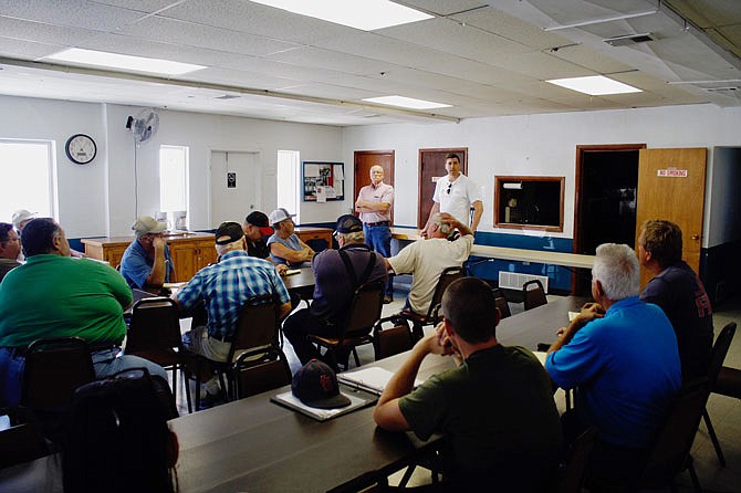 U.S. Army Corps of Engineer representatives Cliff Sander, left, and Mike Dulin address the room at a Tuesday meeting at the Tebbetts Community Center. The meeting was called by Wainwright Levee District President José Cruz to get the Corps to interact with levee presidents, county commissioners and local emergency management.