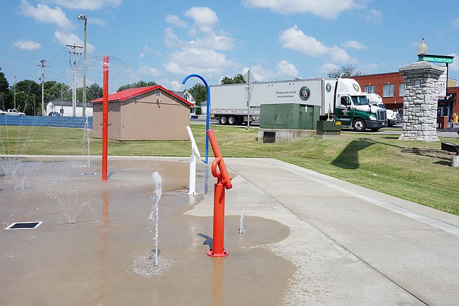 A semi rumbles along on Second Street, just yards away from the Fulton Splash Pad. During Tuesday's City Council meeting, a concerned grandparent pointed out the lack of barrier between the park and the road.