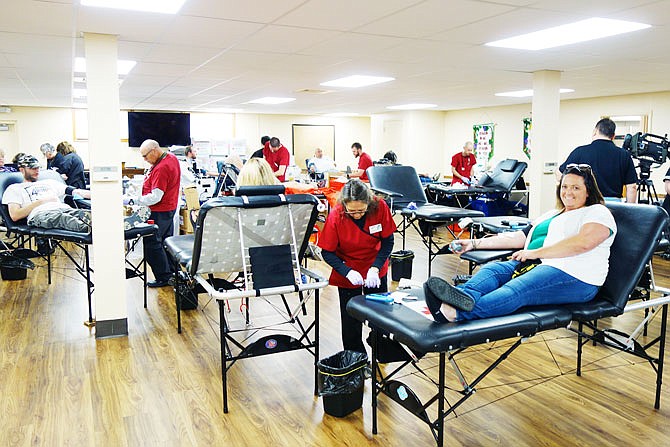 Jennifer Miller, of Fulton, grins and bares her arm for a Super Sam Foundation blood drive in 2019. This year, the blood drive will take place Wednesday and Thursday at the Fulton High School gym. Another blood drive, in memory of Braeden Sconce, is planned for Monday.