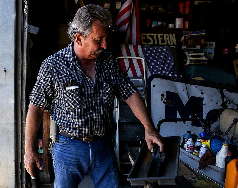 Tom Boyd holds an empty tool tray that was once filled on Wednesday in Texarkana, Texas. Boyd has been selling used cars since 1982 and was robbed while he was gone to Colorado for his brother's memorial service last week. Boyd estimates the person or persons who broke into his business stole equipment that was worth up to $5,000.