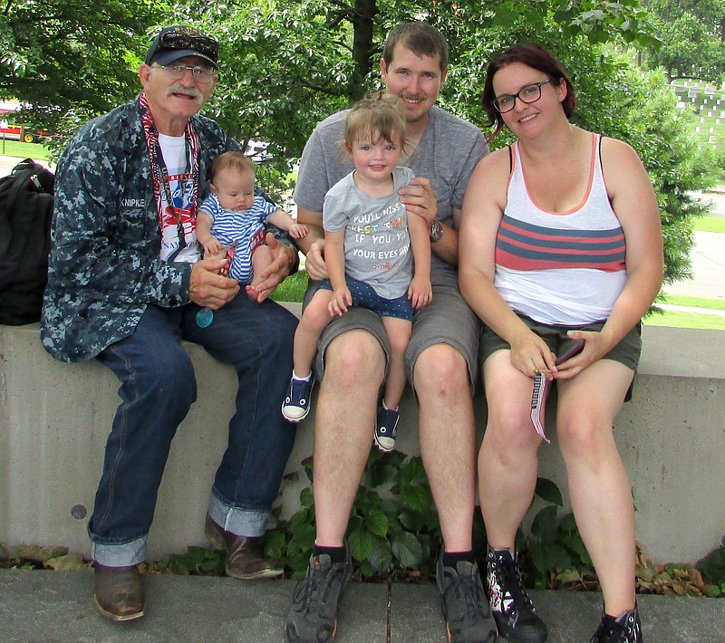 <p>Submitted photo</p><p>Ken Knipker got to meet his new grandson while on the 58th Central Missouri Honor Flight to Washington, D.C. Shown, from left, are Ken Knipker with grandson Remington on his lap, his son Martin, granddaughter Katia and daughter-in-law Cassie Knipker.</p>