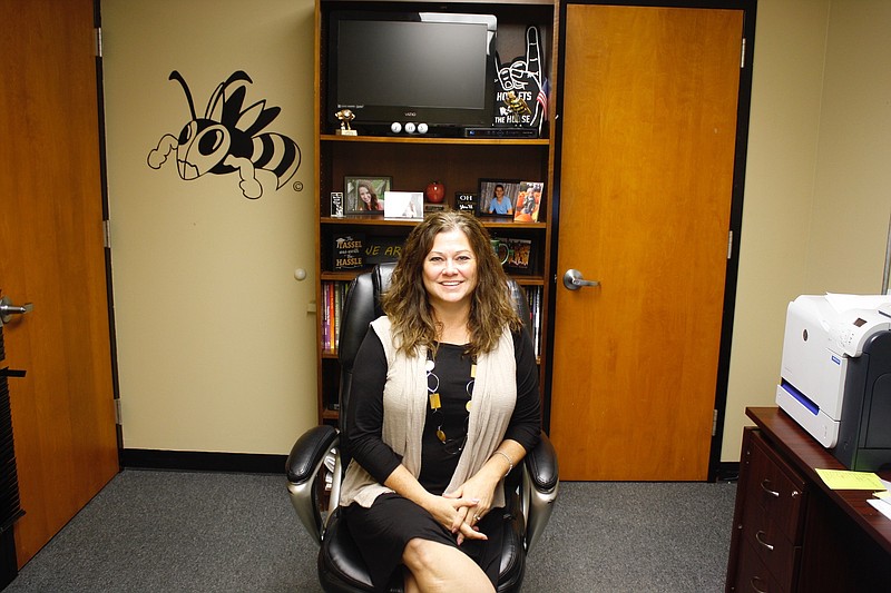 Katie Boland sits in her new office as principal Fulton High School. Boland has worked in the school district for 18 years and was previously an assistant principal at FHS for four years before taking over as principal.