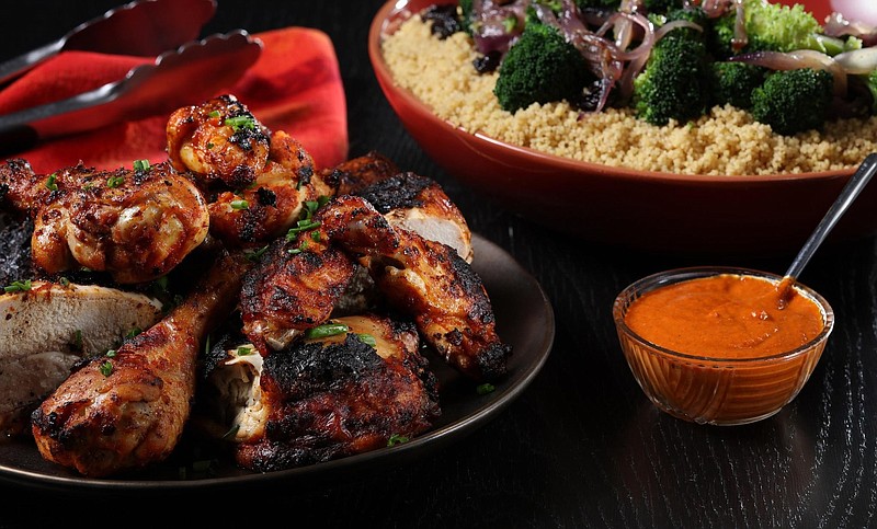 Grilled chicken with harissa sauce and couscous, prepared and styled by Shannon Kinsella, in the test kitchen, Thursday, May 30, 2019. (Abel Uribe/Chicago Tribune/TNS)