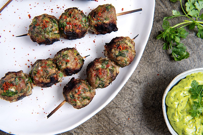 Enjoy these meatballs as a main dish or serve mini skewers as party appetizers. (Mariah Tauger/Los Angeles Times/TNS)
