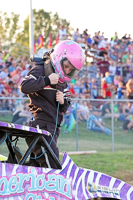 Lil Monster Trucks driver Ally Plewniak, 15, exits her truck, the American Girl, after her freestyle ride Tuesday night, July 30, 2019, at the Jefferson City Jaycees Cole County Fair. 