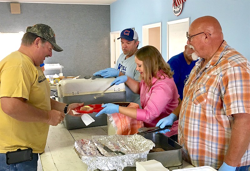 Volunteers serve customers during a previous ham breakfast during the Moniteau County Fair. The breakfast will return Saturday, Aug. 3. 