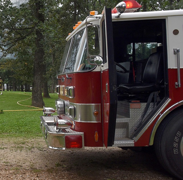 In this July 14, 2016 file photo, a fire truck from the Russellville-Lohman Fire Protection District sits outside a Russellville residence as firefighters extinguish a blaze.