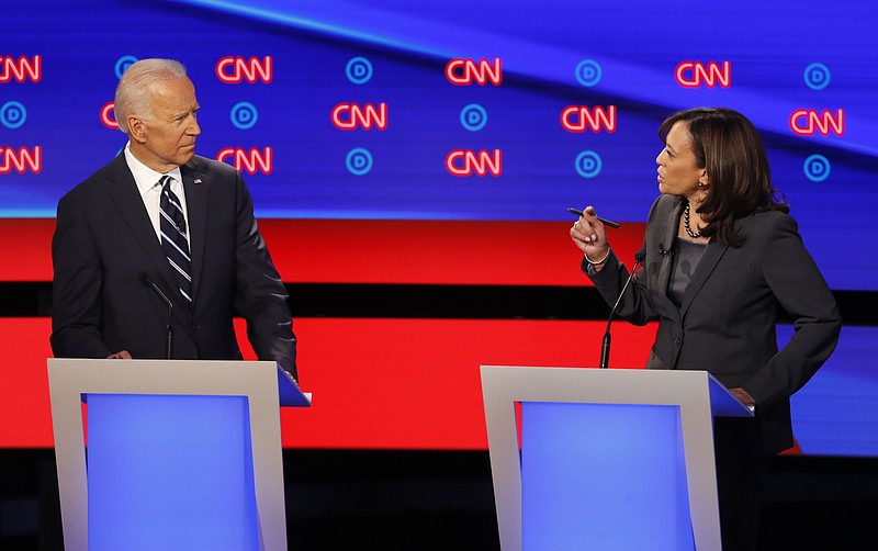 Former Vice President Joe Biden listens as Sen. Kamala Harris, D-Calif., speaks during the second of two Democratic presidential primary debates hosted by CNN Wednesday, July 31, 2019, in the Fox Theatre in Detroit. (AP Photo/Paul Sancya)