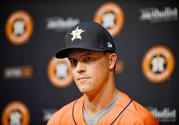 Astros pitcher Zack Greinke listens to a question Friday during a press conference in Houston.